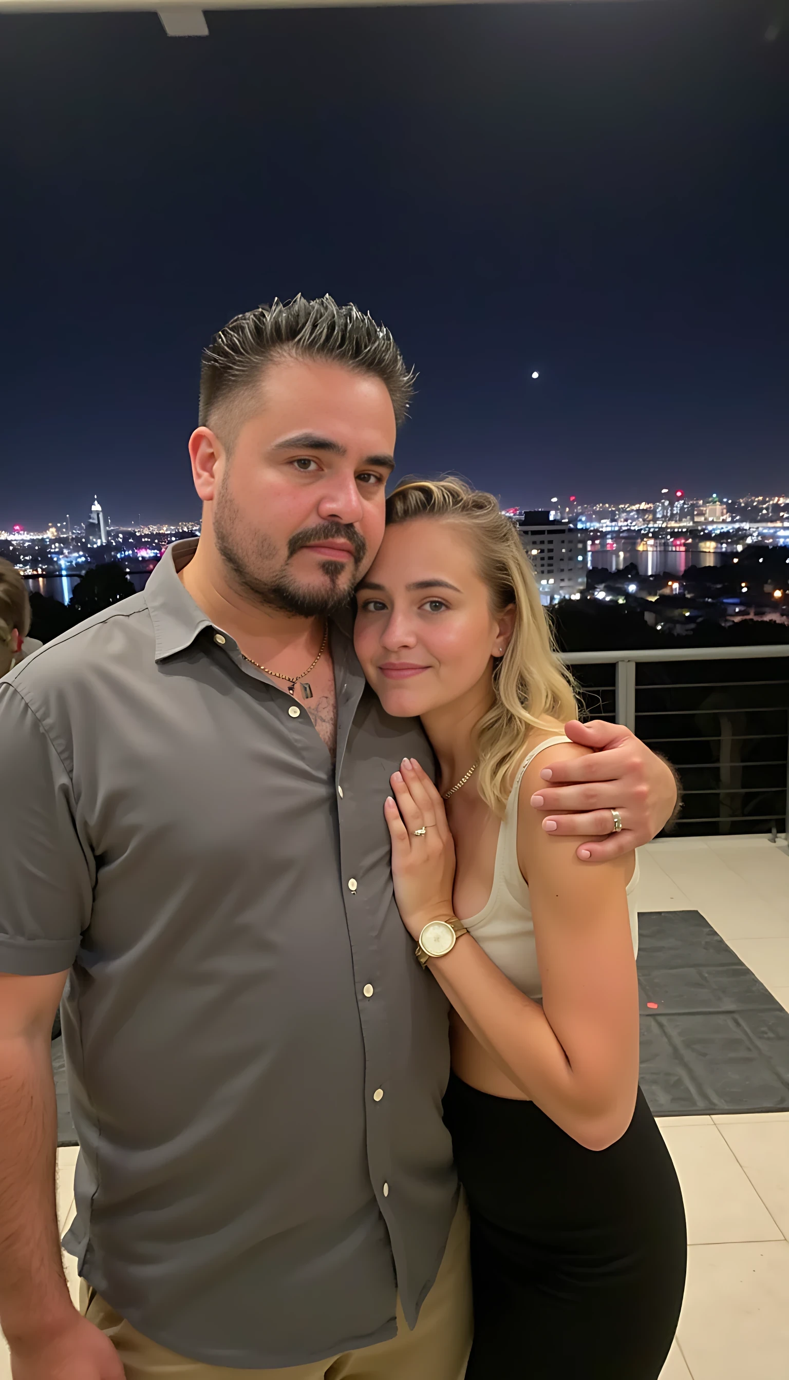 Selfie in a  mirror full man body wearing a  nice gray dress shirt   Hugging a beautiful blonde woman with blue eyes girl in a  big city night lights background 
