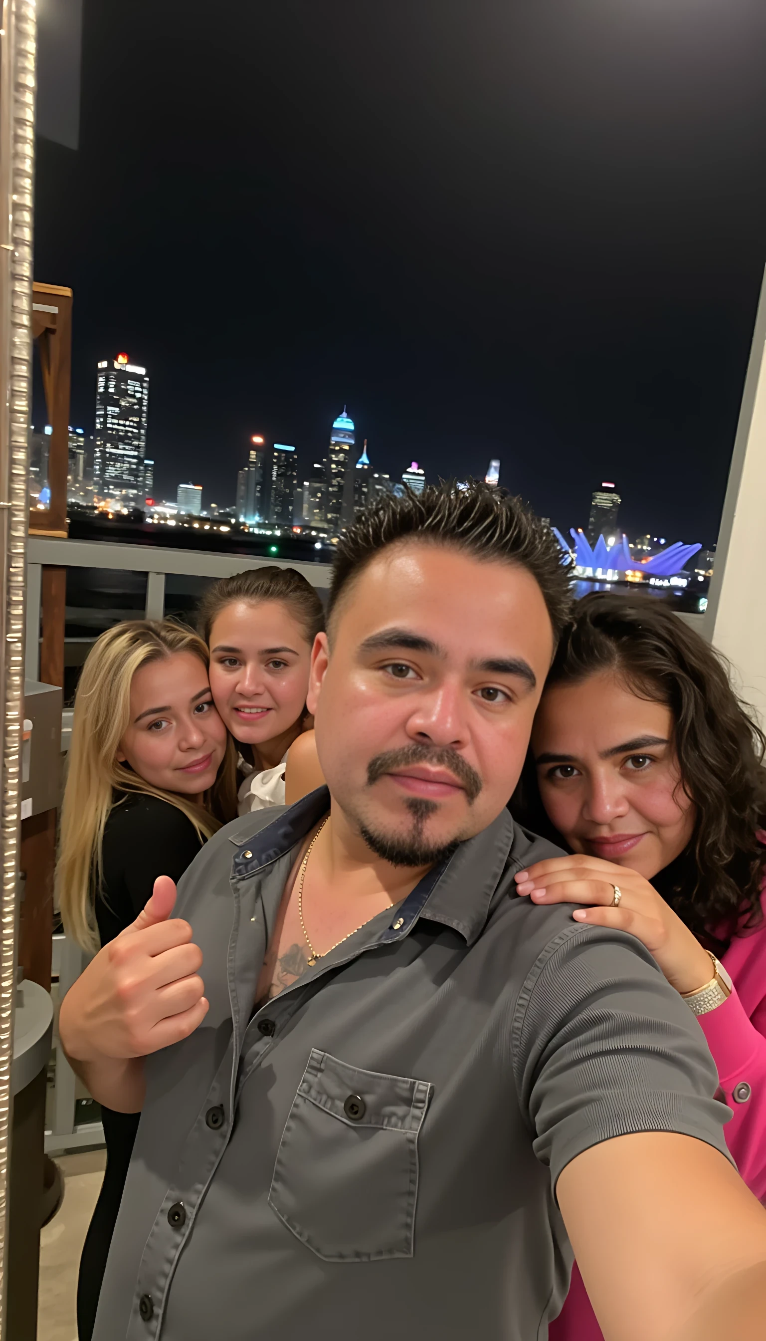 Selfie in a  mirror full man body wearing a  nice gray dress shirt   Hugging with 1 blonde girl with blue eyes and 1 Mexican girl in a  big city night lights background 
