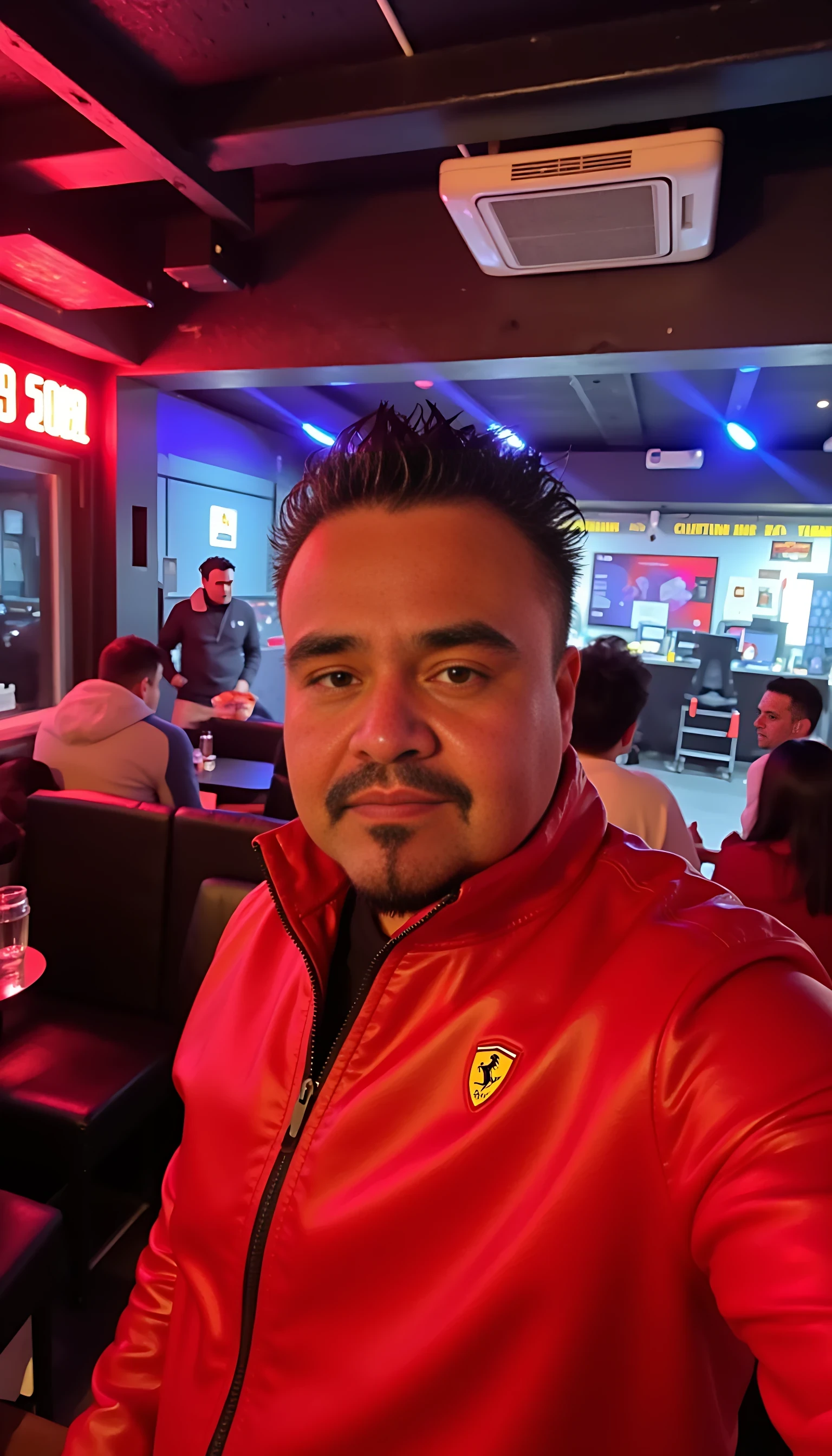 CSTMDL  selfie man average body wearing red leather jacket with a Ferrari logo standing 
With nightclub background 