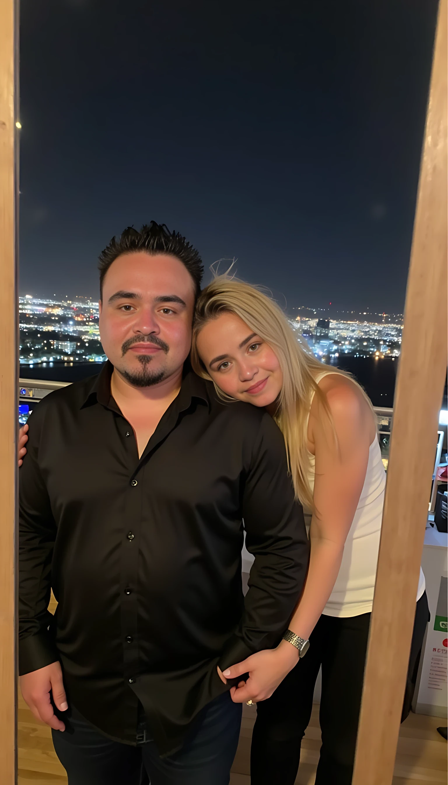 Selfie in a  mirror full man body wearing a  nice black dress shirt   Hugging with 1 blonde girl with blue eyes and 1 Mexican girl in a  big city night lights background 

