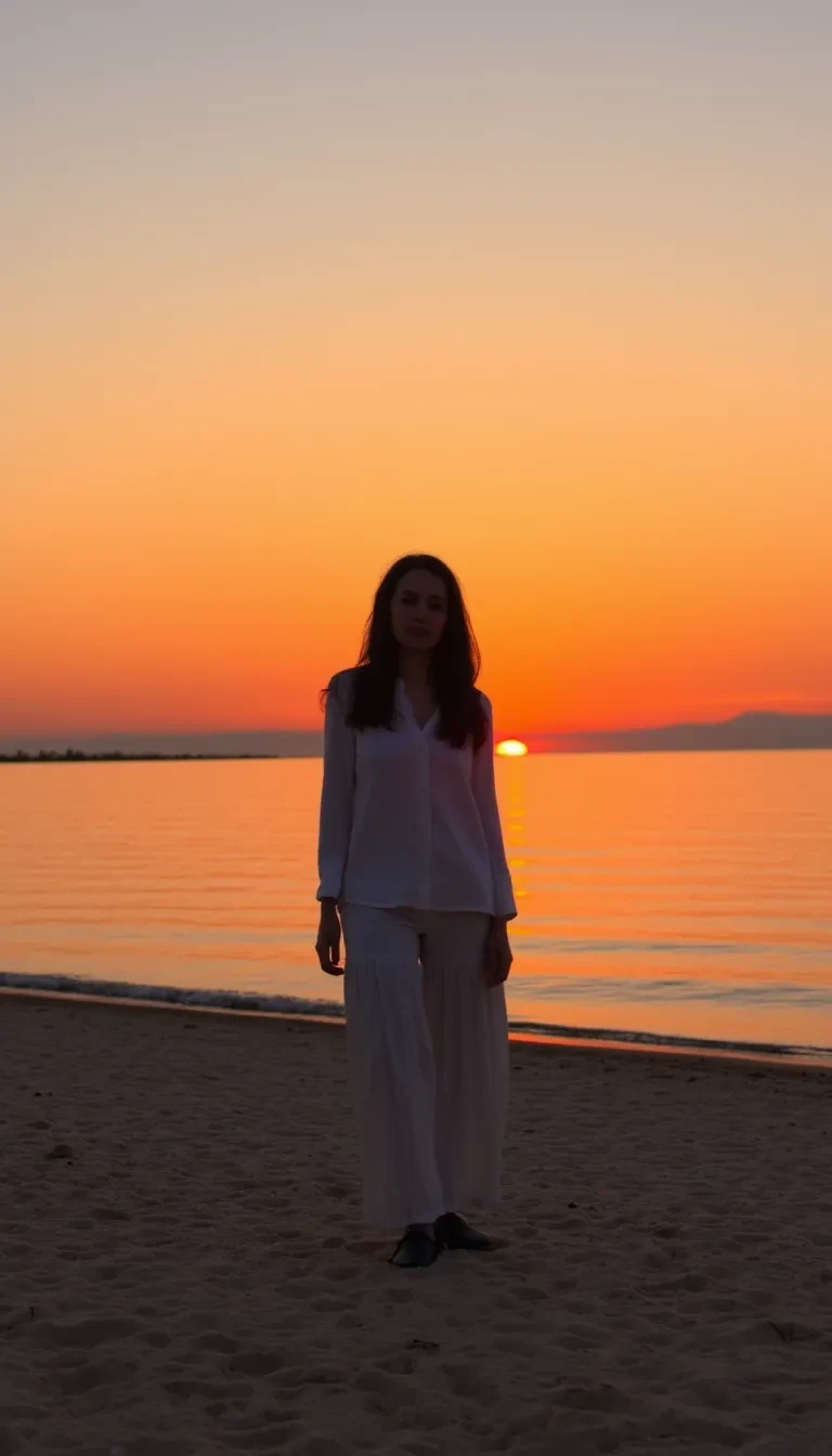 a woman standing on a sandy beach at sunset fa0pain6nm1v2q8tg7792zr4