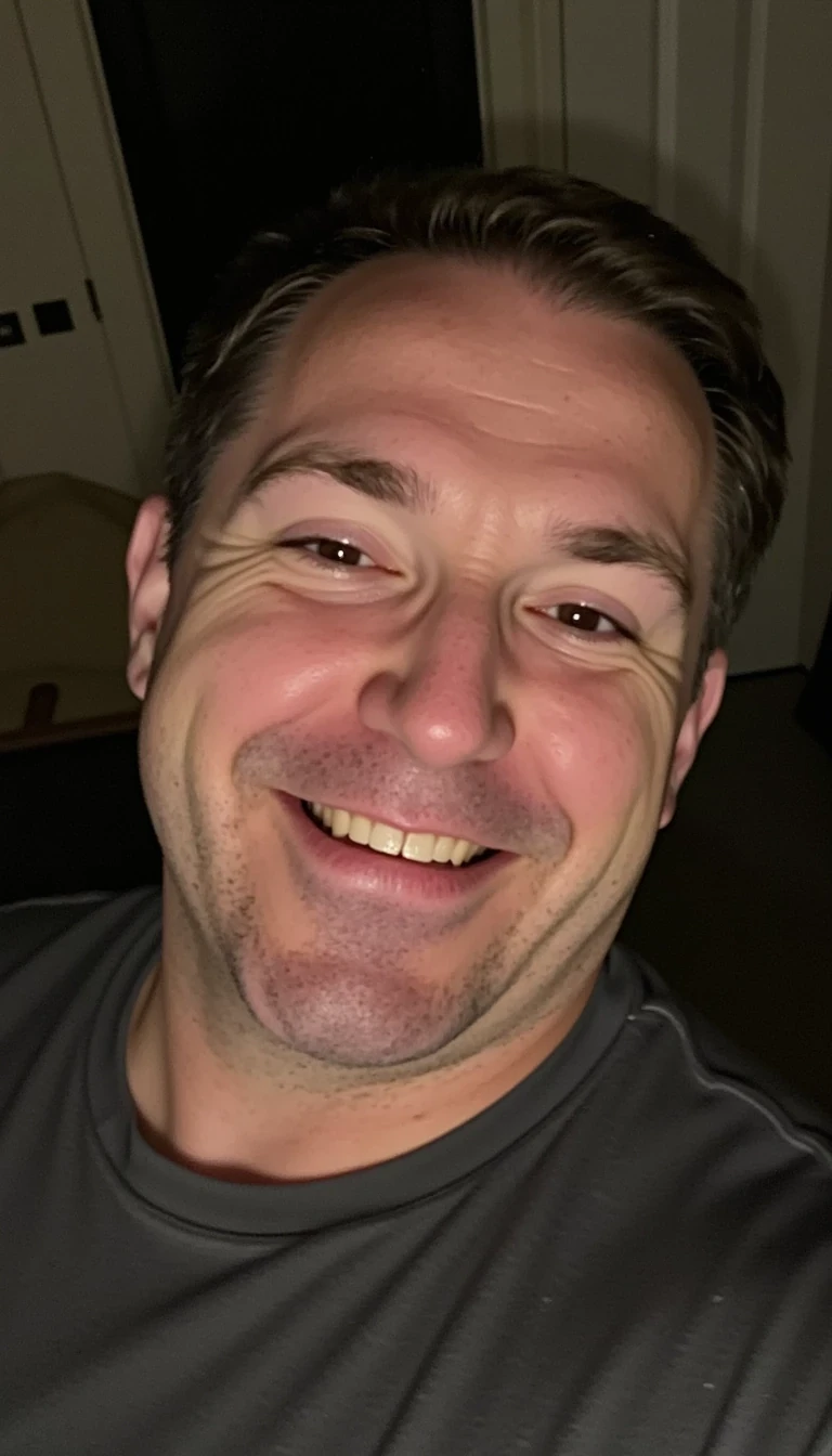 Late night close up iPhone selfie of a 40s man CSTMDL with dad bod. he does not have a double chin. he is clean shaven. 