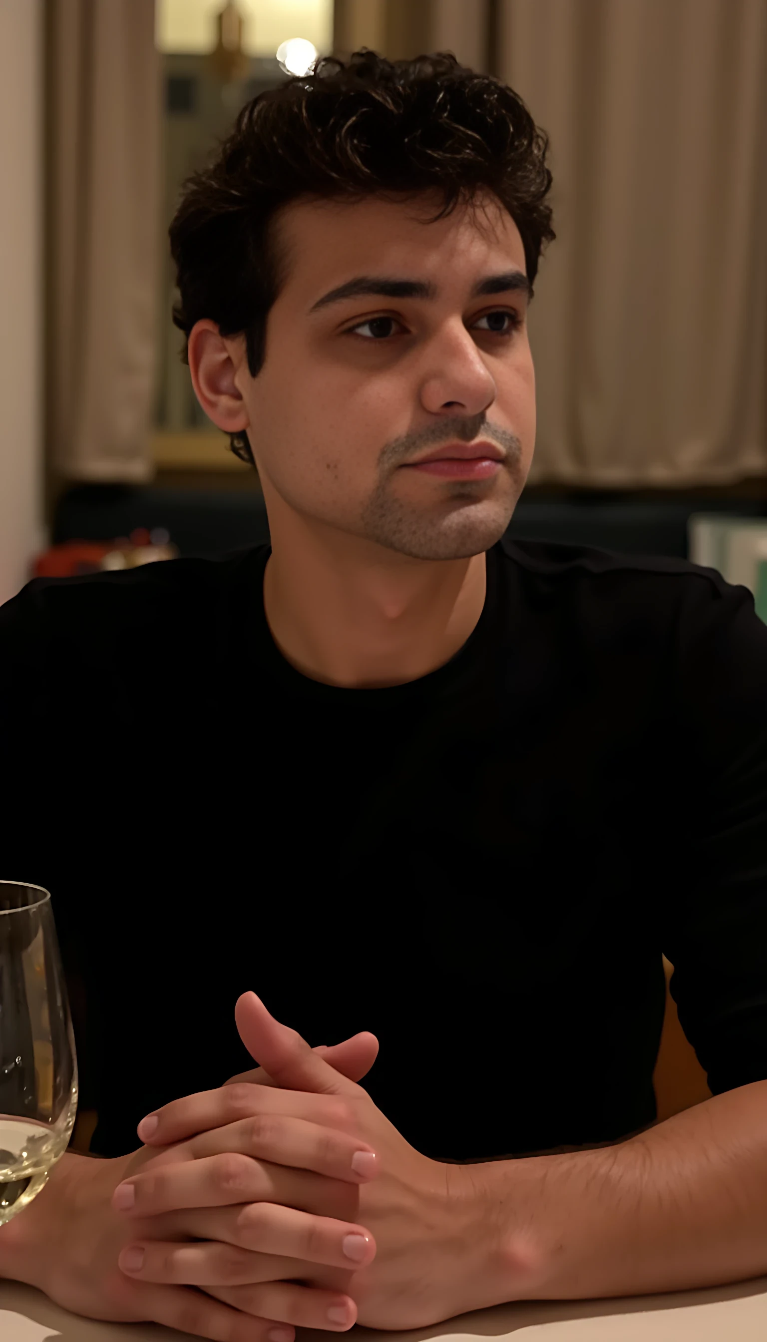 CSTMDL handsome 20 year old man A man sitting at a cozy restaurant table during evening hours, dressed in a fitted dark shirt, looking slightly to the side as if in conversation. Soft warm lighting, casual glass of wine on the table, normal hands with normal number of fingers, good quality hands. Background out of focus, no other people visible. Hyper-realistic date-night feel.