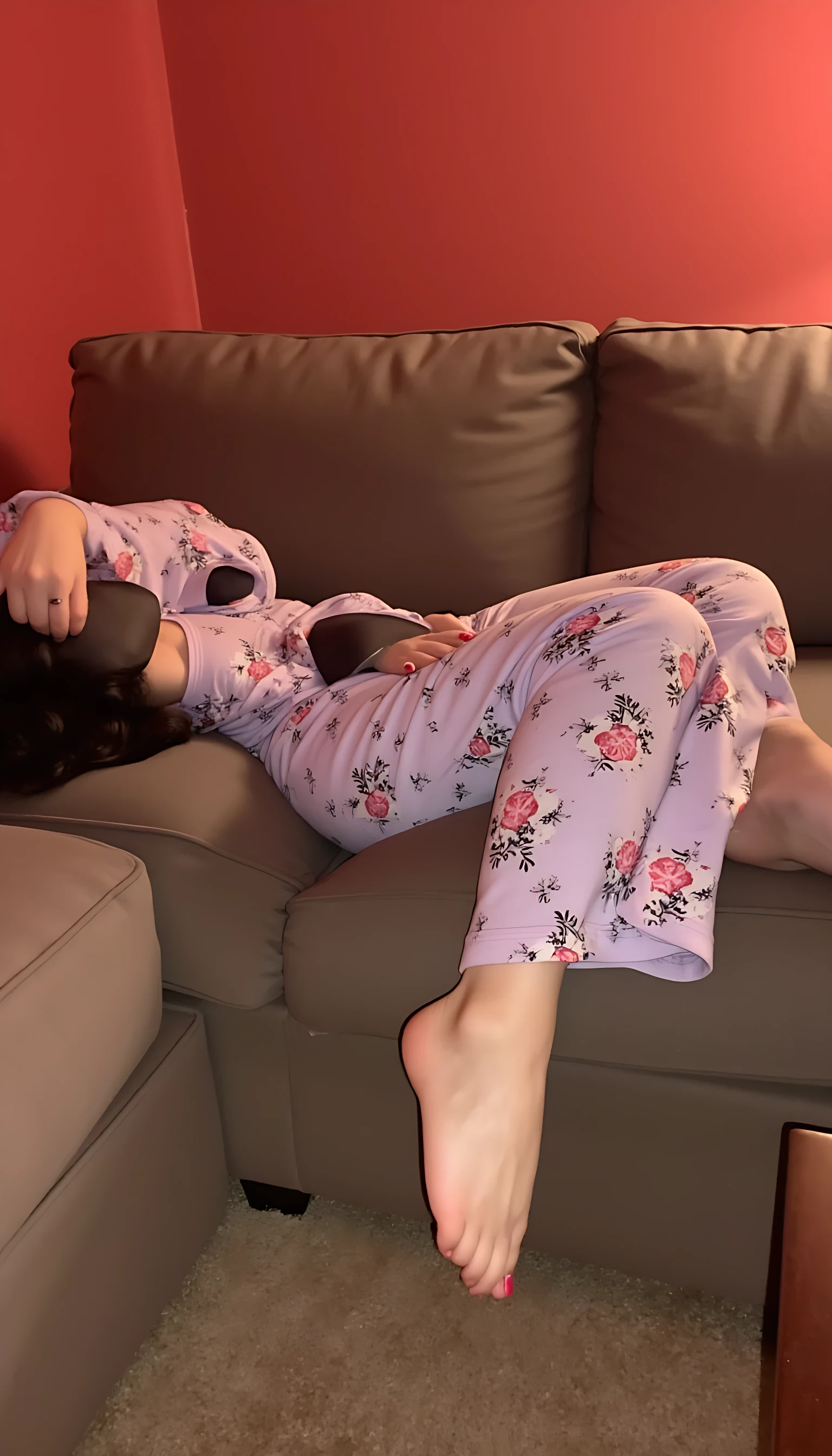 Laying on the couch, in pajamas, one hand down her pants playing with herself, CSTMDL red walls and brown carpet 