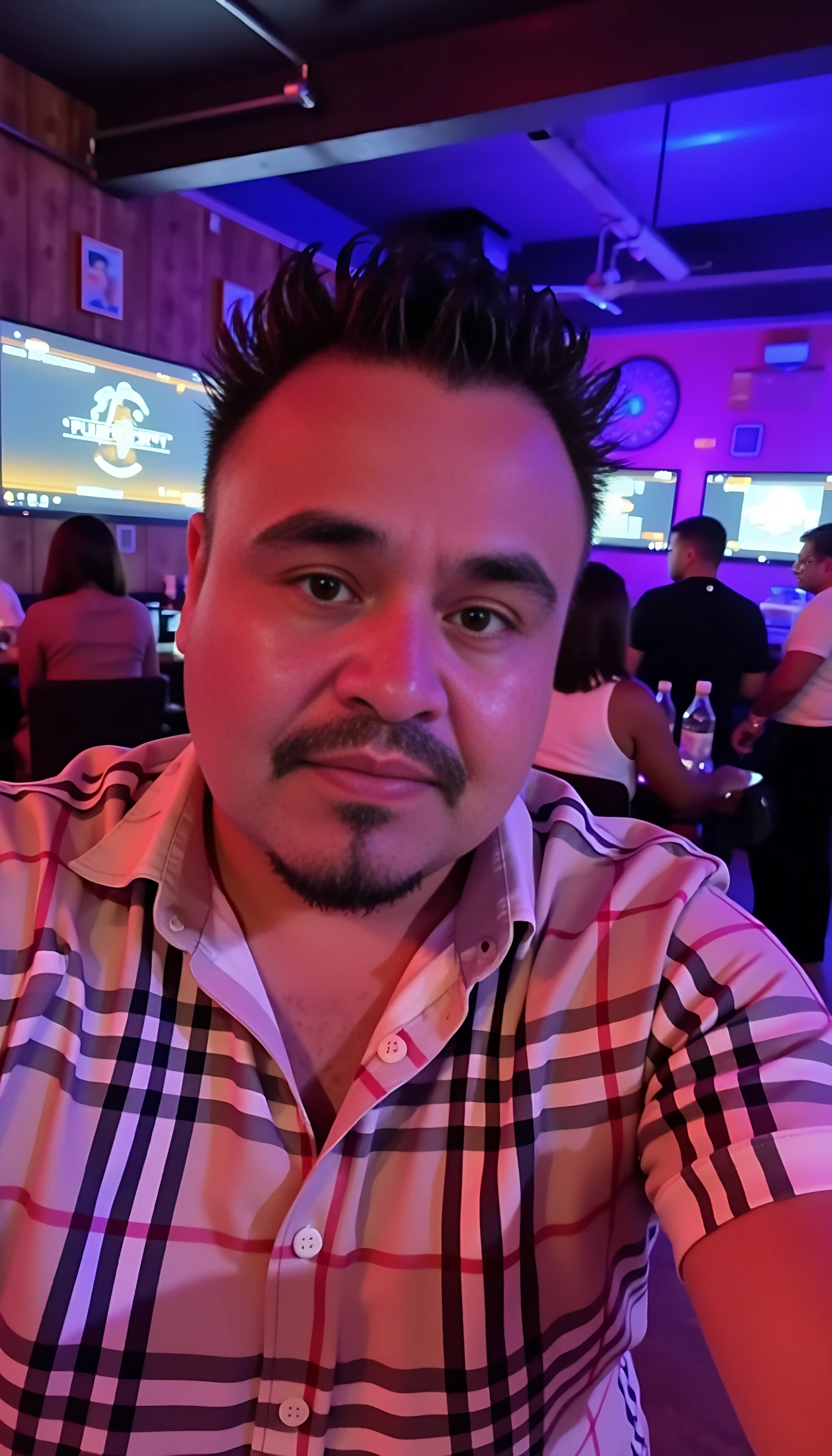 CSTMDL  selfie man average body wearing a Burberry shirt standing 
With nightclub background 