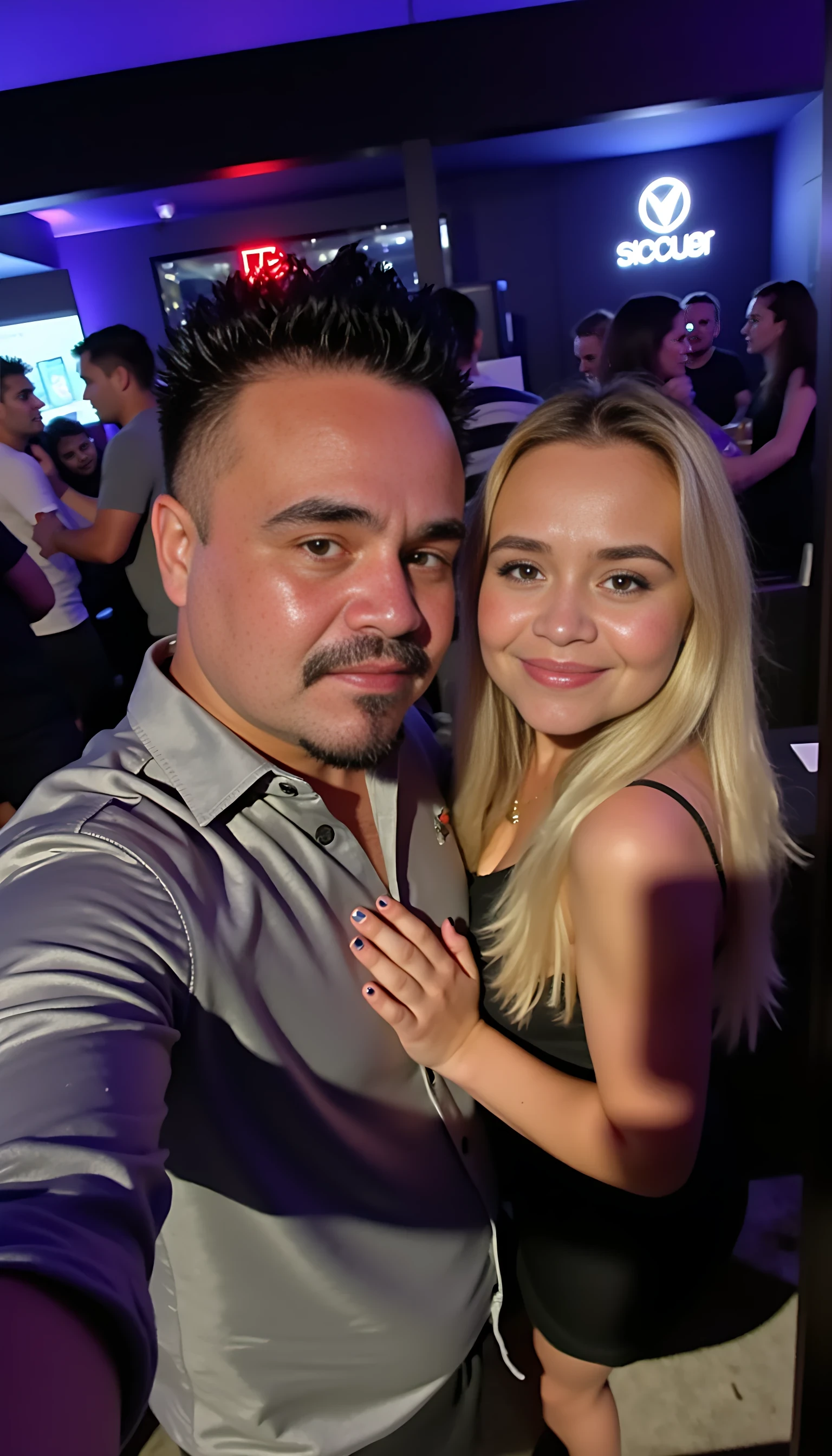 Selfie in a  mirror full man body wearing a  nice gray dress shirt   Hugging a beautiful blonde woman with blue eyes girl in a nightclub background 
