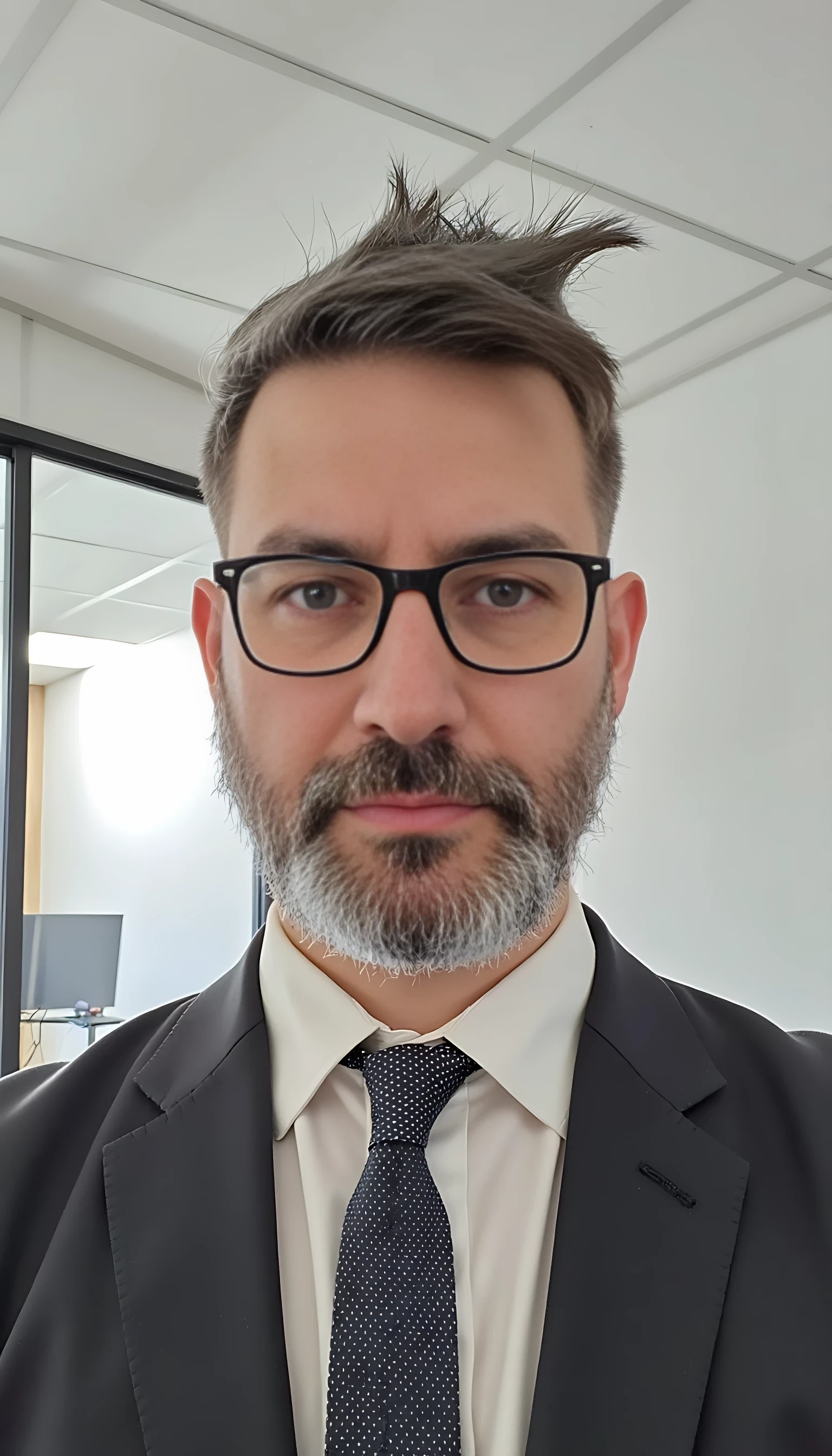 Full body image. Make him identical to the original trained model. Businessman with modern and expensive fashion outfit. He is wearing a suit and modern Ray-Ban reading glasses. Slim but muscular build. He is facing the camera directly, as if posing for a LinkedIn profile picture. He looks like a CEO of a huge corporation. His forehead is not that large.