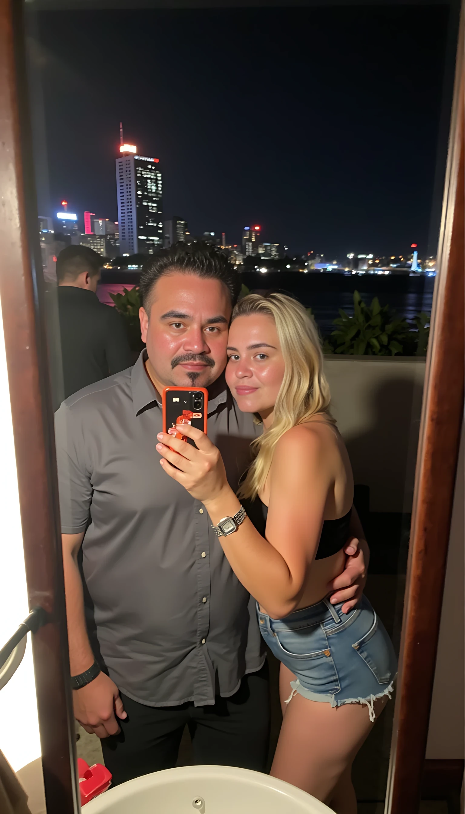 Selfie in a  mirror full man body wearing a  nice gray dress shirt   Hugging with 1 blonde girl with blue eyes and 1 Mexican girl in a  big city night lights background 
