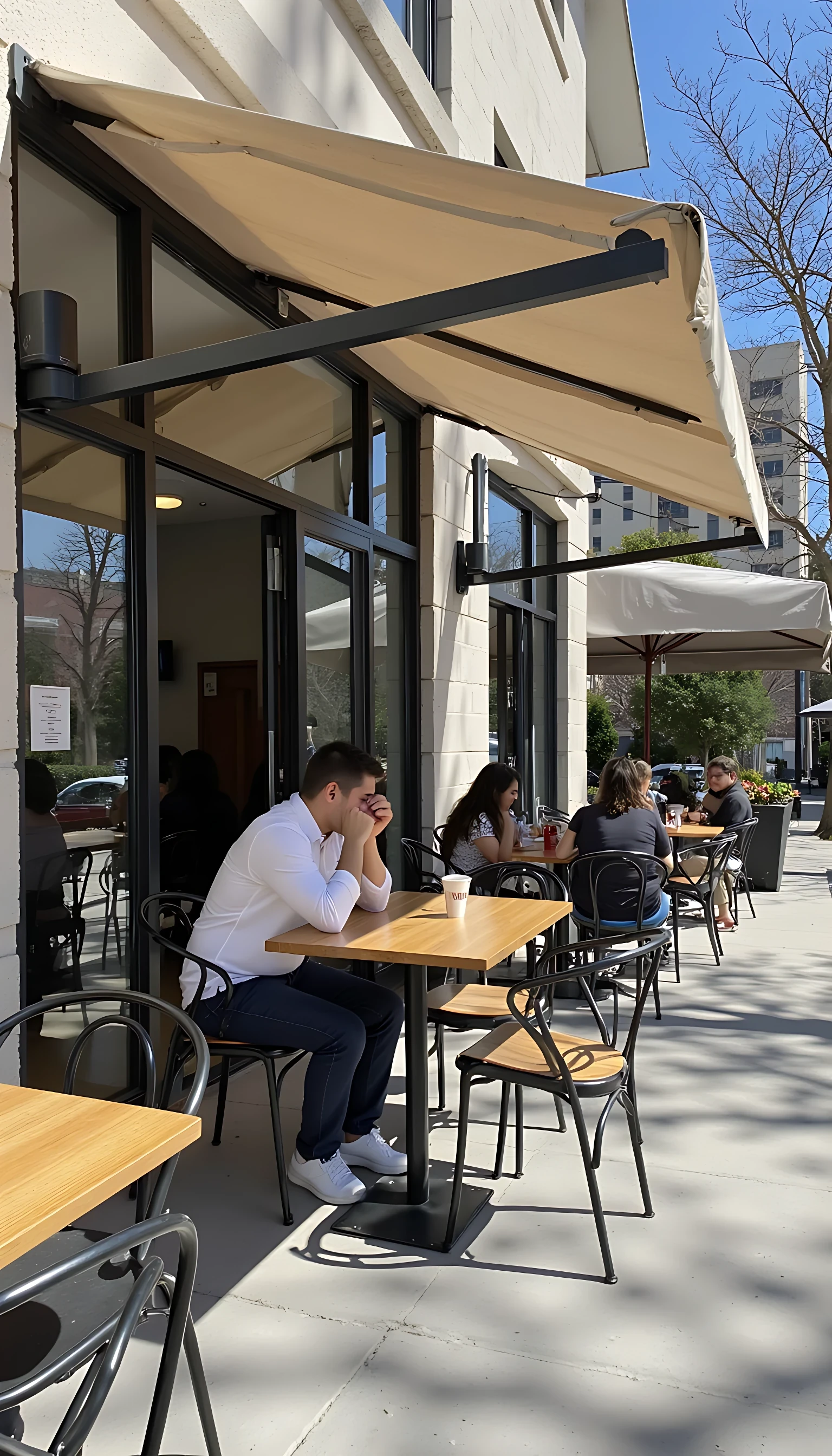 CSTMDL sat outdoors at a restaurant