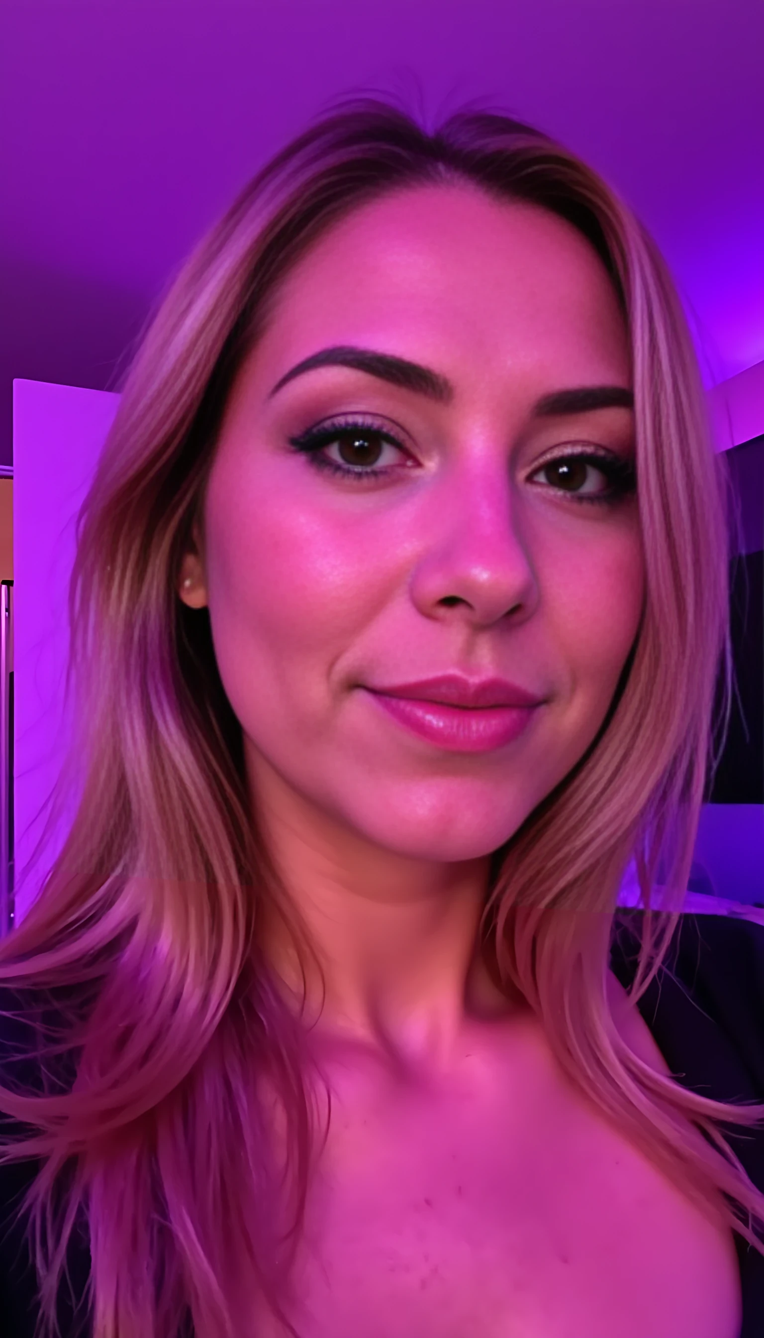 A close-up portrait of CSTMDL, a soft, muted pink-purple lighting effect, and a neutral makeup aesthetic, shot in a dimly lit room with a purple-toned wall; style mimicking a contemporary social media portrait.